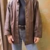 vintage brown leather jacket with design in the front