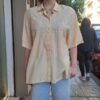 vintage vanilla shirt with white stiched embroidery