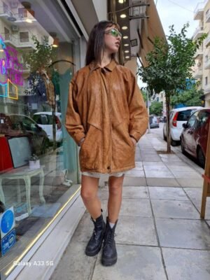 vintage caramel leather jacket with big pockets and shoulder pads