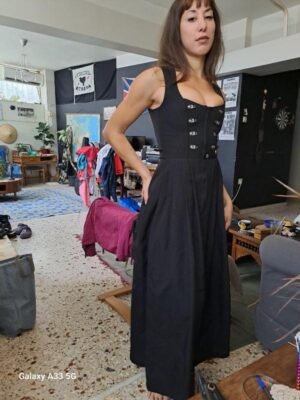 Alternative view of vintage black sleeveless corset style midi dress with metal clasp details and a flared skirt