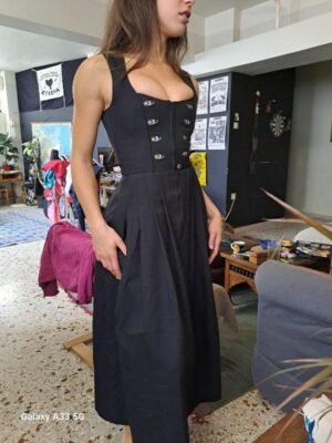 vintage black sleeveless corset style midi dress with metal clasp deails and a flared skirt