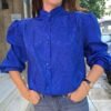 vintage electric blue shirt with subtle leopard jacquard detailing, high neck and puff sleeves