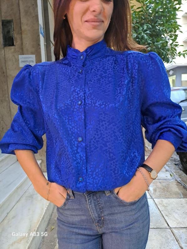vintage electric blue shirt with subtle leopard jacquard detailing, high neck and puff sleeves
