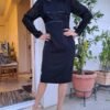 vintage black midi dress with velvet detailing on the bodice and lace sleeves