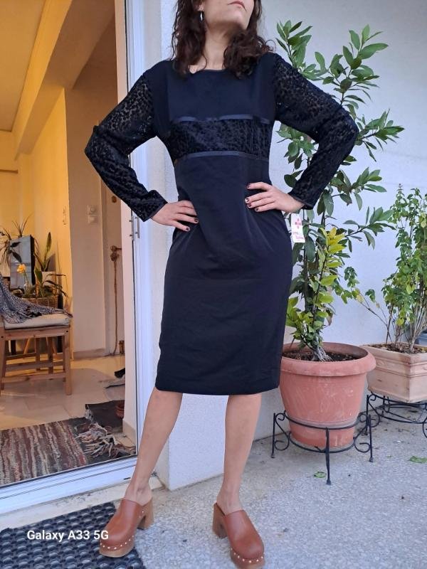 vintage black midi dress with velvet detailing on the bodice and lace sleeves