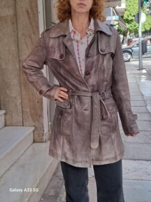 vintage leather trenchcoat in adistressed brown tone features waist belt, large flap pockets and shoulder epaulettes