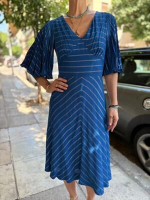 Alternative view of 70's vintage blue stripped dress featuring fitted waist, flare skirt and acordeon sleeves
