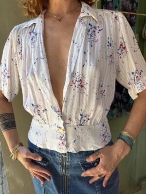 vintage white printed top with fitted waist, pleats and deep V neck